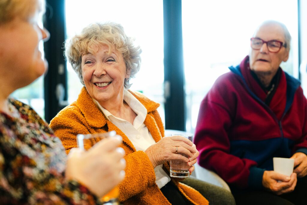 Three older adults socializing. Credit Centre for Aging Better